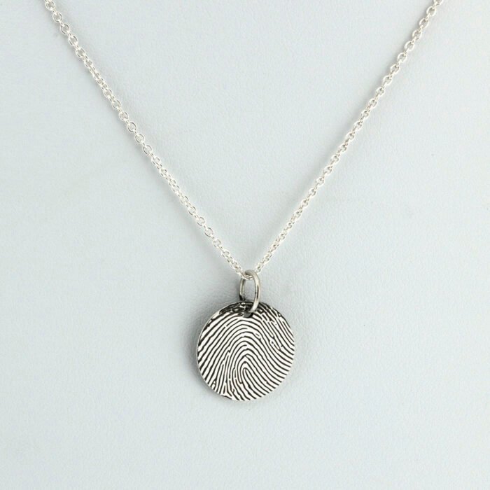 silver fingerprint charm necklace with multiple engraved discs