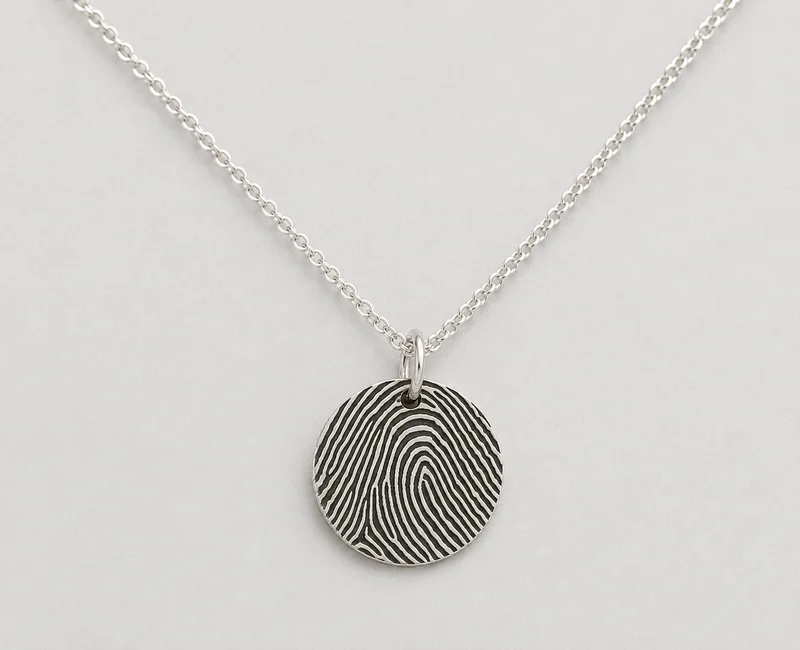 Finished silver fingerprint necklace engraved edge to edge with a personal fingerprint