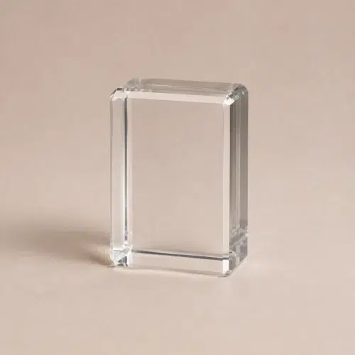 Small clear rectangular crystal block C0003 displayed in portrait orientation