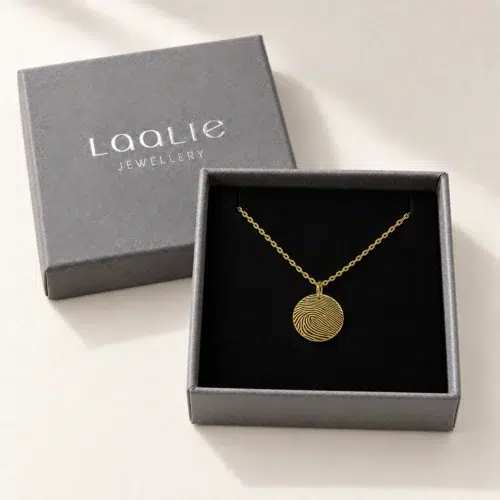 13mm gold coloured stainless steel fingerprint disc necklace in an open grey Laalie gift box