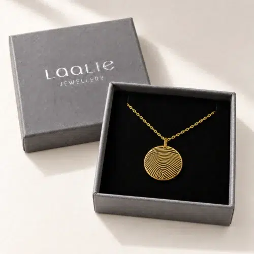 18mm gold coloured stainless steel fingerprint disc necklace in an open grey Laalie gift box