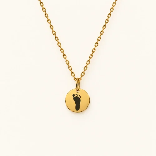 9mm gold coloured stainless steel disc necklace with a single footprint.