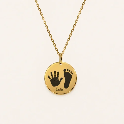 15mm gold coloured stainless steel disc necklace with a handprint and footprint.