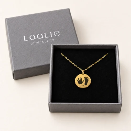 15mm gold coloured stainless steel disc necklace with a handprint and footprint, in a Laalie gift box.