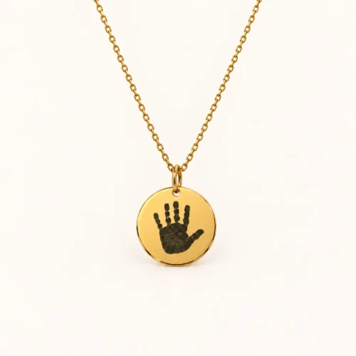 13mm gold coloured stainless steel disc necklace with a single handprint.