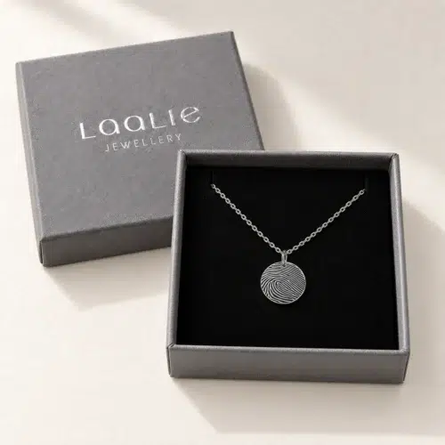 13mm silver coloured stainless steel fingerprint disc necklace in an open grey Laalie gift box