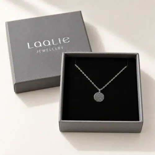 9mm silver coloured stainless steel fingerprint disc necklace in an open grey Laalie gift box