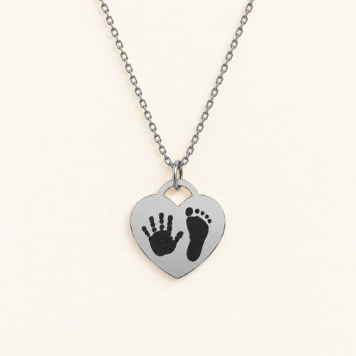 15mm silver coloured stainless steel heart necklace with a handprint and a footprint.